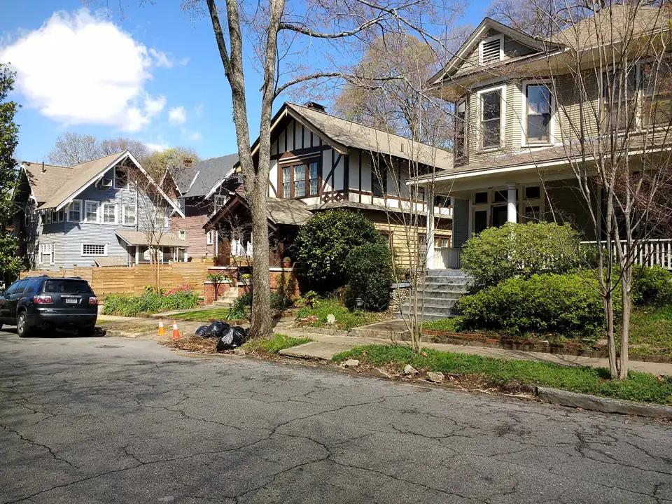 Older houses on a tree-lined street in Highland Park, Birmingham, Alabama